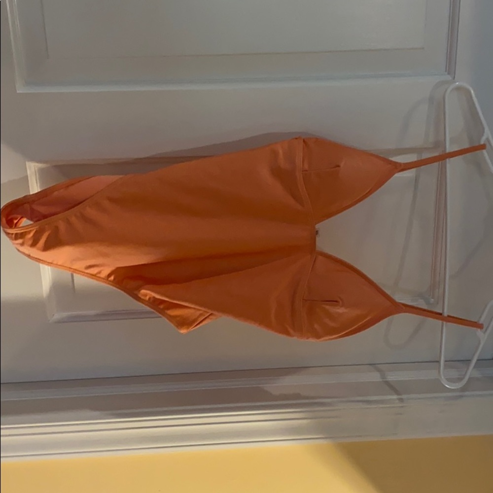 Bright orange one piece bathing suit